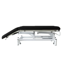 Camilla eléctrica de dos cuerpos Kinefis Quality (tapizada en negra): Con ruedas escamoteables, respaldo reclinable por pistón de gas, estructura blanca de gran estabilidad - Última Unidad en stock Camilla eléctrica de dos cuerpos Kinefis Quality (tapizada en negra): Con ruedas escamoteables, respaldo reclinable por pistón de gas, estructura blanca de gran estabilidad - Última Unidad en stock